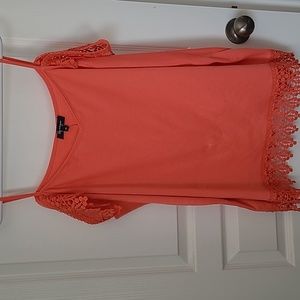 Lily Morgan peach orange colored sleeveless top. It's a 3x and A line shape